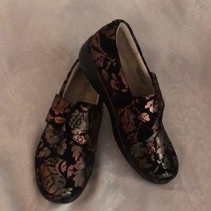 Alegria slip on shoes with top adjustable strap.